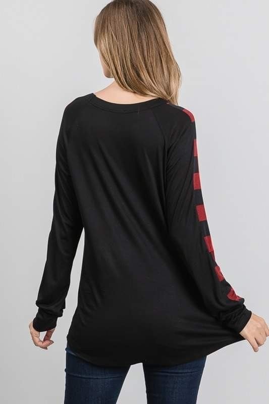 Extremely Soft and Stretchy Black with Red Plaid Arms and Pocket Runs a bit Big. Made in the USA